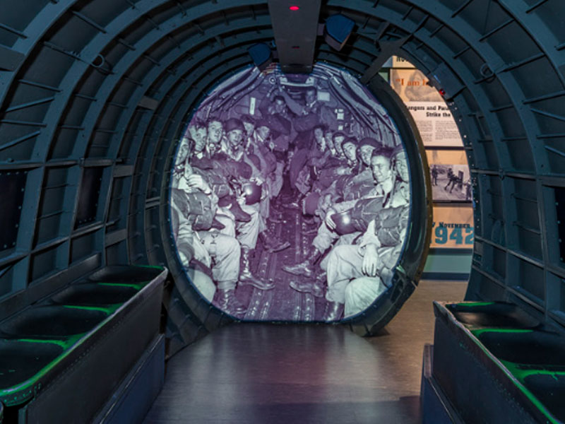 A museum exhibit of the inside of an aircraft with a life-like display to imitate a real life environment.